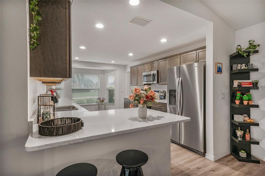 276 North Cunningham Avenue Inverness, FL 34453 - Photo 20 of 48 a kitchen with refrigerator and window