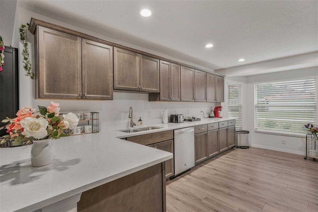 276 North Cunningham Avenue Inverness, FL 34453 - Photo 21 of 48 a kitchen with a sink cabinets and window