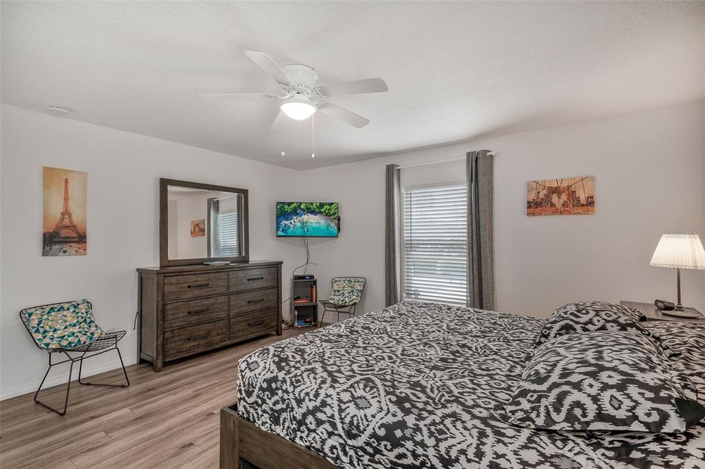 276 North Cunningham Avenue Inverness, FL 34453 - Photo 28 of 48 a bedroom with a bed and a dresser in it