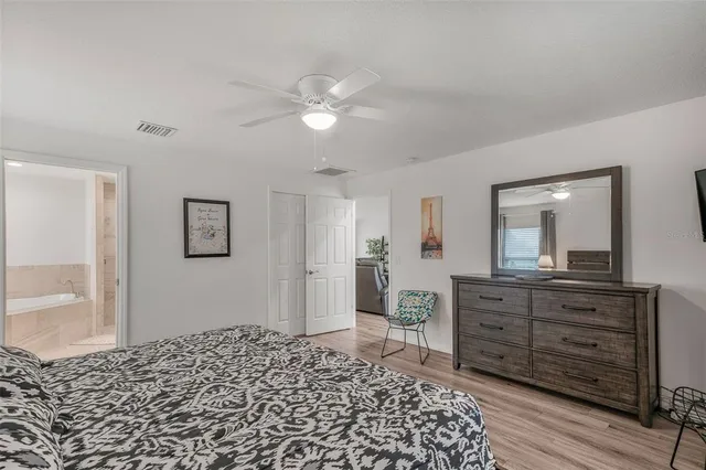 a bedroom with a bed and a dresser