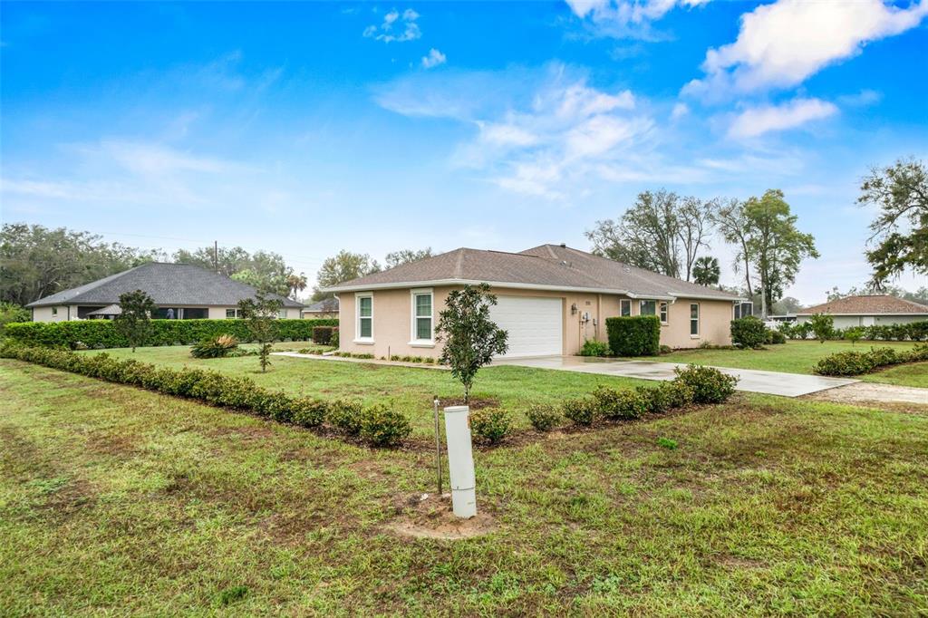 276 North Cunningham Avenue Inverness, FL 34453 - Photo 4 of 48 a front view of a house with a yard