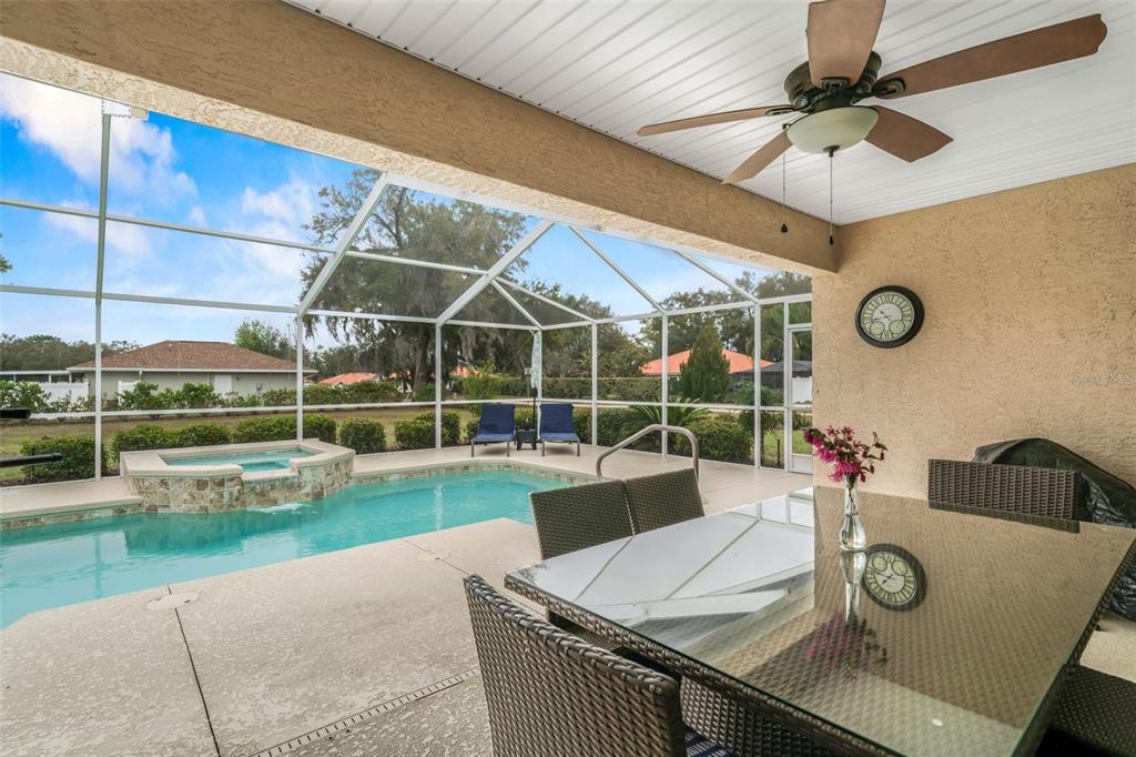276 North Cunningham Avenue Inverness, FL 34453 - Photo 42 of 48 a view of a patio with table and chairs potted plants with wooden floor