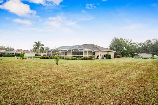 a front view of a house with a big yard