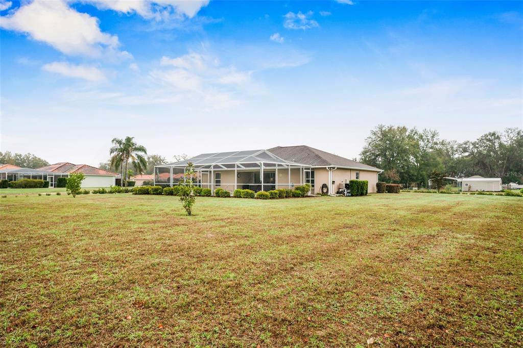 276 North Cunningham Avenue Inverness, FL 34453 - Photo 8 of 48 a front view of a house with a big yard