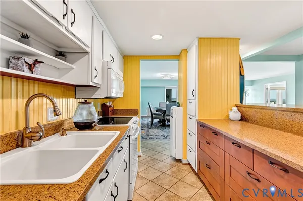 a living room with a large window and a couch