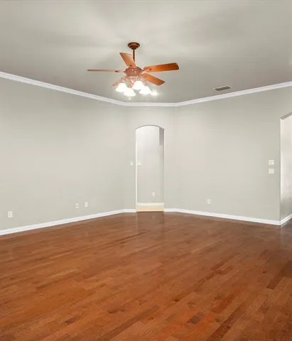a kitchen with stainless steel appliances granite countertop a stove a sink and white cabinets