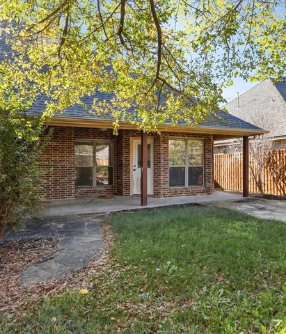 a front view of a house with a large window