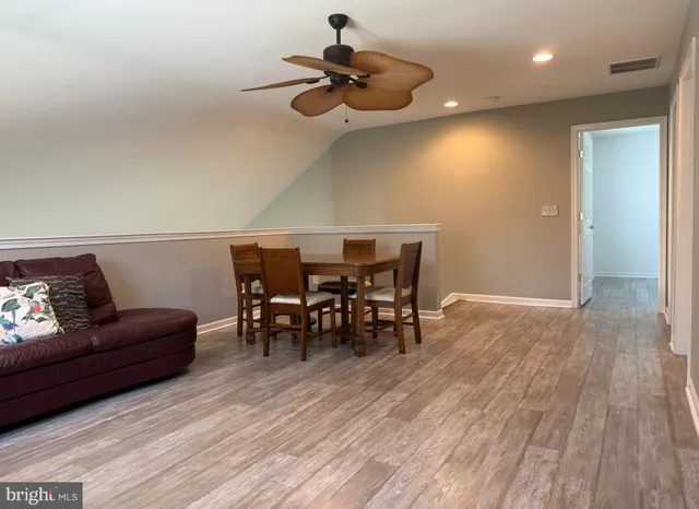 a view of a livingroom with furniture and wooden floor
