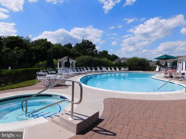 a view of a swimming pool with a patio