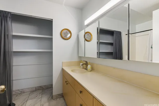 a bathroom with a sink and a mirror