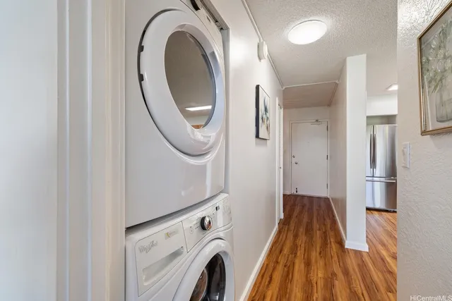 a view of a hallway with washer and dryer