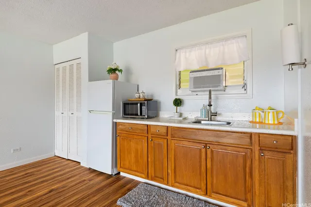 a spacious bathroom with a sink double vanity granite and a mirror