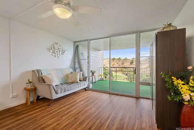 a living room with furniture and a gate