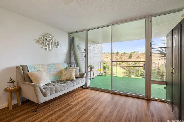 a living room with furniture and a large window