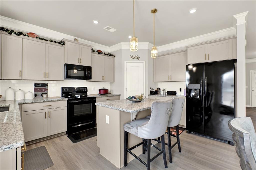25 Thacker Trail Adairsville, GA 30103 - Photo 15 of 47 a kitchen with a sink stainless steel appliances and cabinets