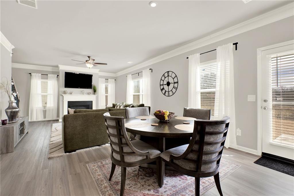 25 Thacker Trail Adairsville, GA 30103 - Photo 18 of 47 a view of a dining room with furniture and a fireplace