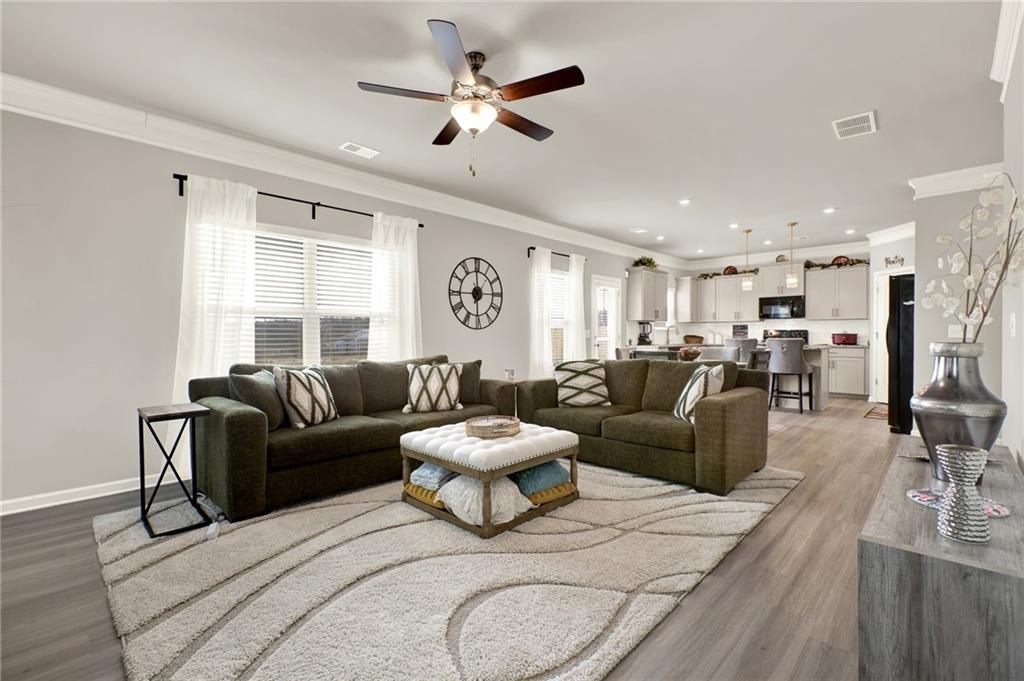 25 Thacker Trail Adairsville, GA 30103 - Photo 19 of 47 a living room with furniture a ceiling fan and a window