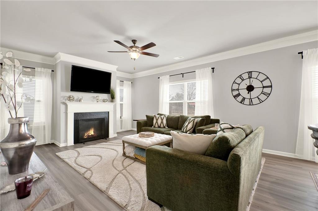25 Thacker Trail Adairsville, GA 30103 - Photo 20 of 47 a living room with furniture a flat screen tv and a fireplace