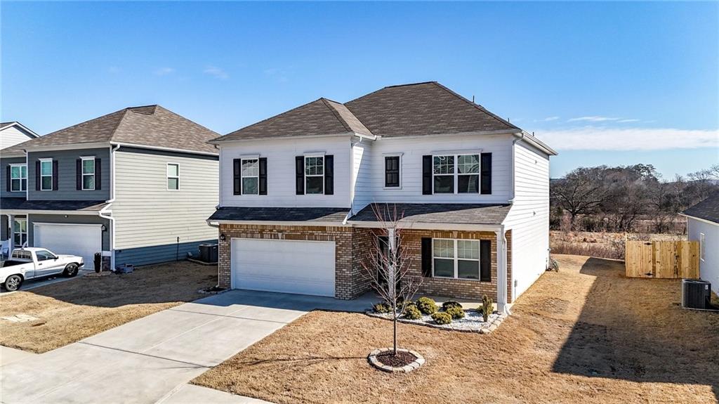 25 Thacker Trail Adairsville, GA 30103 - Photo 2 of 47 a front view of a house with a yard