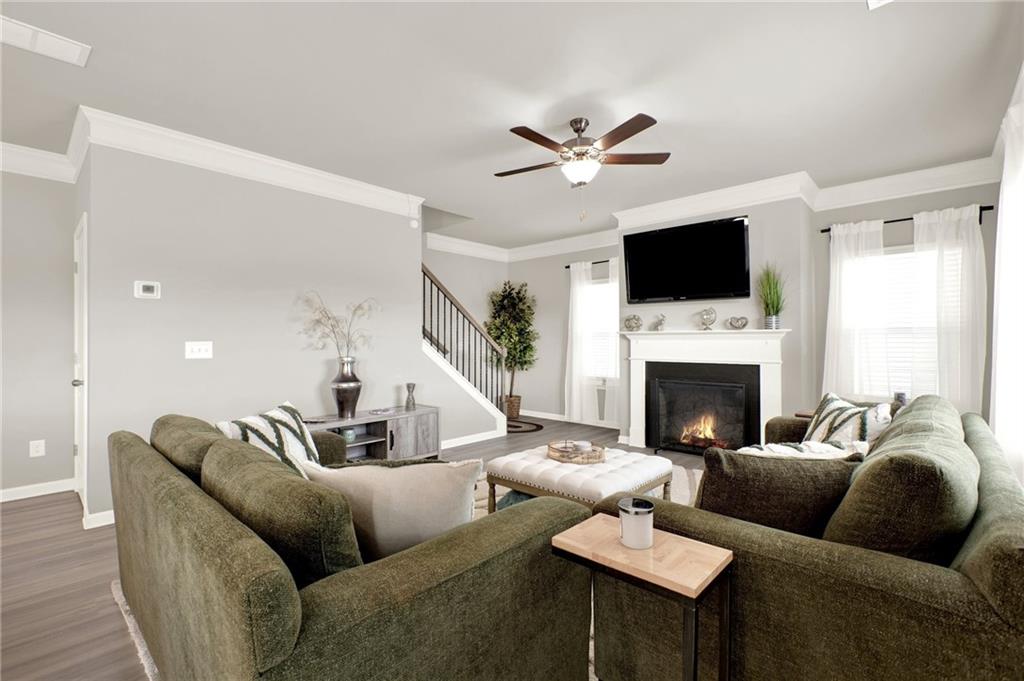 25 Thacker Trail Adairsville, GA 30103 - Photo 21 of 47 a living room with furniture a fireplace and a flat screen tv