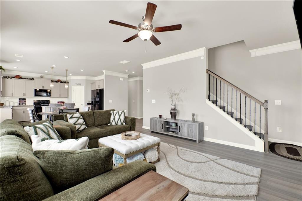 25 Thacker Trail Adairsville, GA 30103 - Photo 22 of 47 a living room with furniture kitchen view and a wooden floor