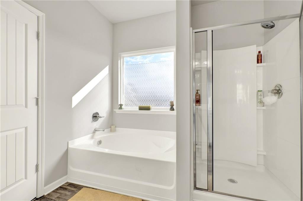 25 Thacker Trail Adairsville, GA 30103 - Photo 29 of 47 a bathroom with a bathtub and a shower