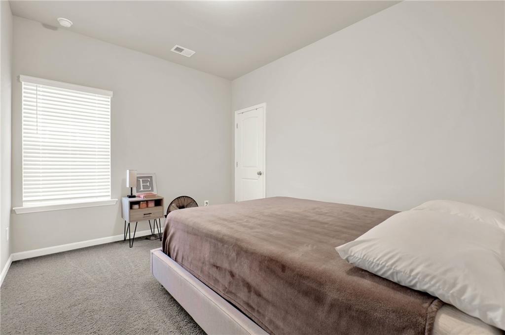 25 Thacker Trail Adairsville, GA 30103 - Photo 31 of 47 a bedroom with a bed and a window