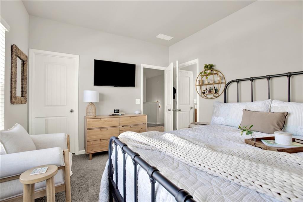 25 Thacker Trail Adairsville, GA 30103 - Photo 37 of 47 a spacious bedroom with a bed and a flat screen tv