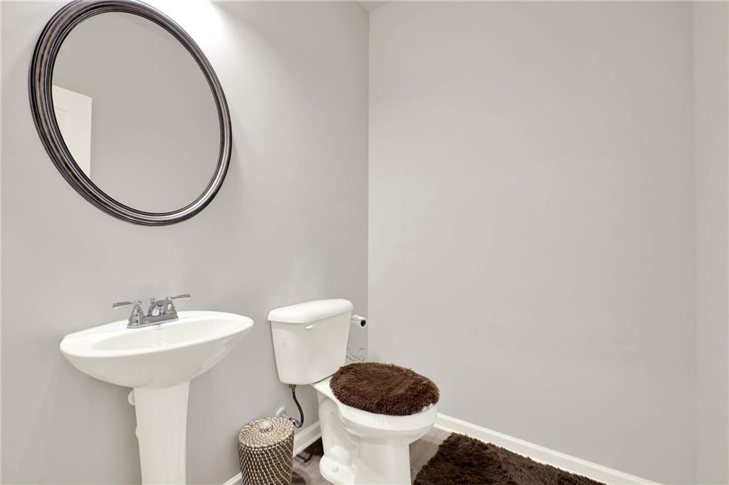 25 Thacker Trail Adairsville, GA 30103 - Photo 10 of 47 a bathroom with a toilet and a sink