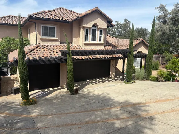 a front view of a house with yard