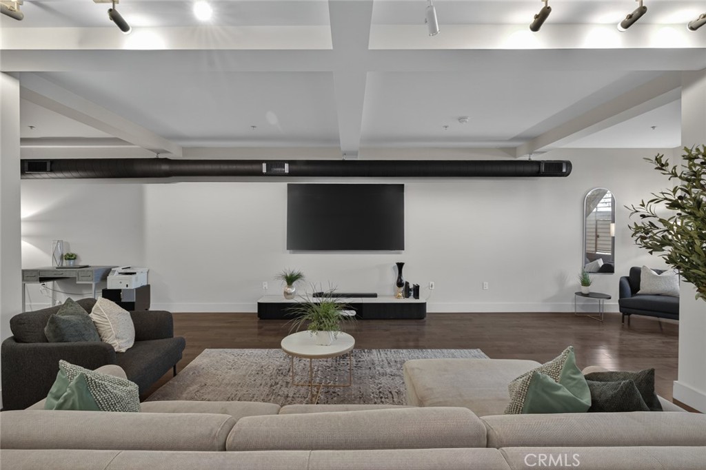 433 Pine Avenue, Unit 102 Long Beach, CA 90802 - Photo 1 of 60 a living room with furniture and a flat screen tv