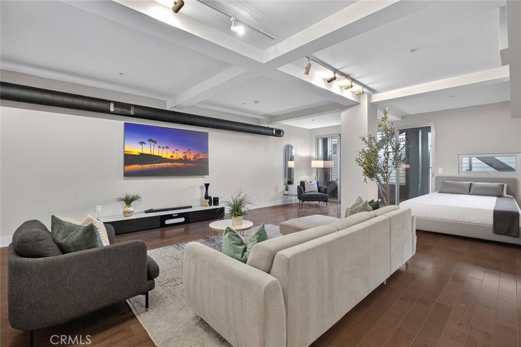 433 Pine Avenue, Unit 102 Long Beach, CA 90802 - Photo 1 of 60 a living room with furniture and a flat screen tv