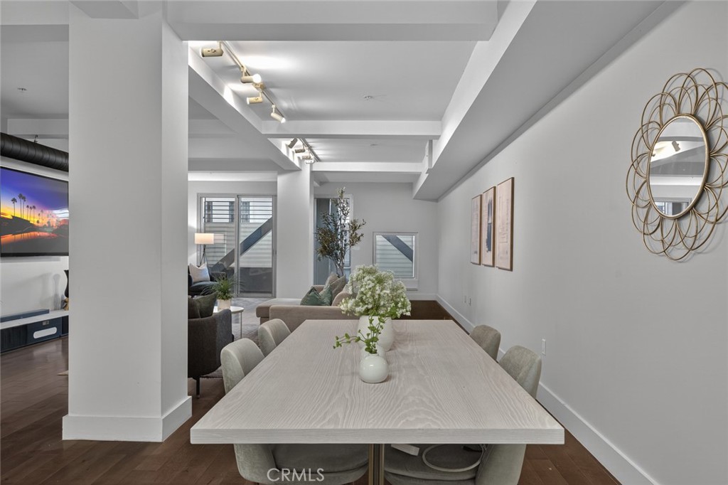 433 Pine Avenue, Unit 102 Long Beach, CA 90802 - Photo 12 of 60 a view of a dining room with furniture and wooden floor