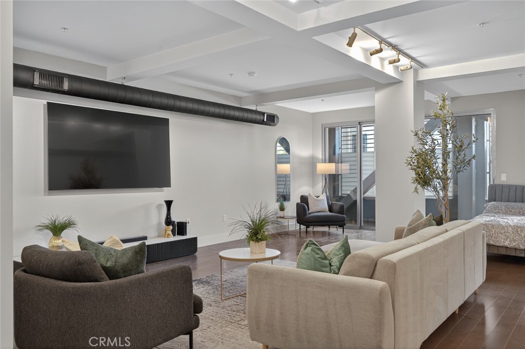 433 Pine Avenue, Unit 102 Long Beach, CA 90802 - Photo 13 of 60 a living room with furniture and a flat screen tv