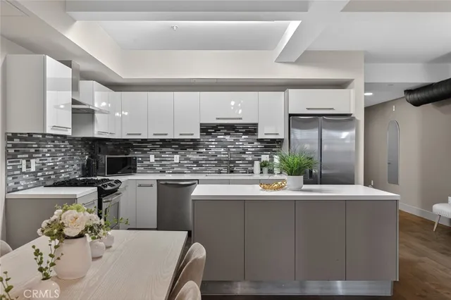 a bedroom with a bed and mirror