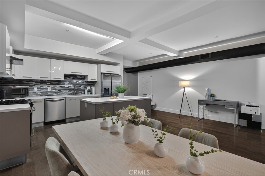 433 Pine Avenue, Unit 102 Long Beach, CA 90802 - Photo 17 of 60 a kitchen with kitchen island granite countertop lots of counter top space and furniture
