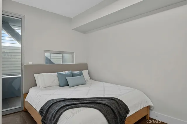 a view of a kitchen area with furniture and wooden floor