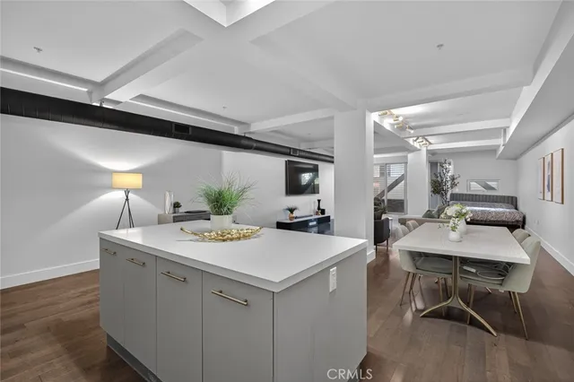 a bathroom with a sink a light fixture and a mirror