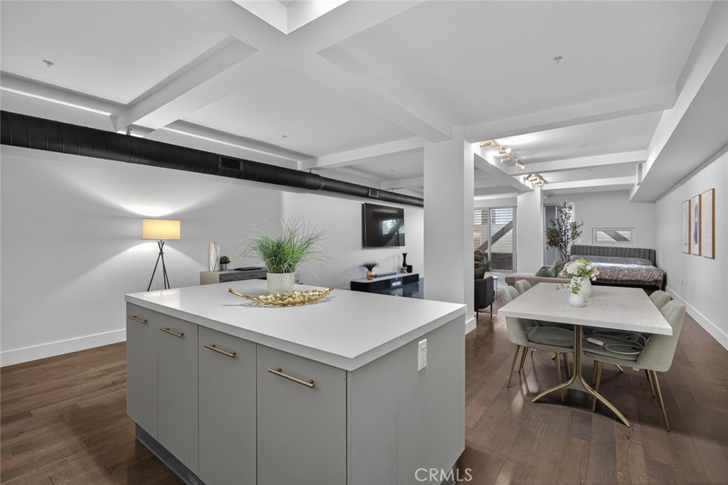433 Pine Avenue, Unit 102 Long Beach, CA 90802 - Photo 20 of 60 a view of a kitchen area with furniture and wooden floor