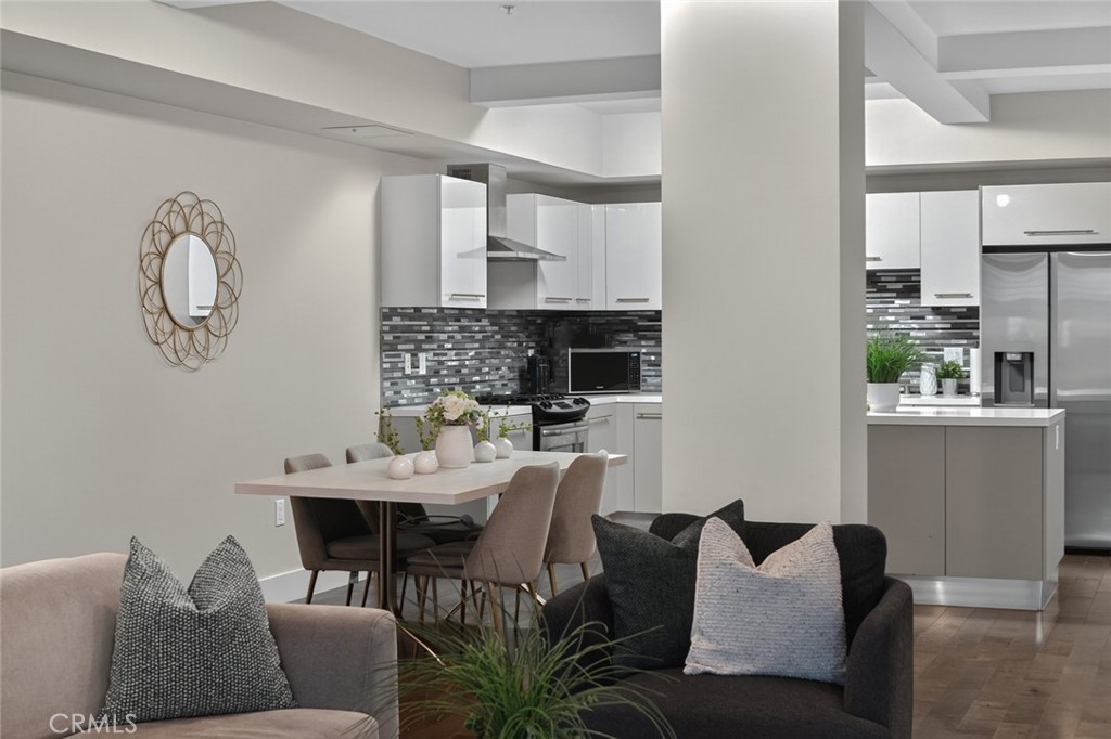433 Pine Avenue, Unit 102 Long Beach, CA 90802 - Photo 26 of 60 a view of a dining room with furniture and a table
