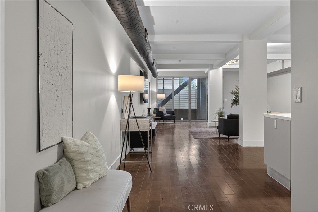 433 Pine Avenue, Unit 102 Long Beach, CA 90802 - Photo 27 of 60 a living room with furniture and a wooden floor
