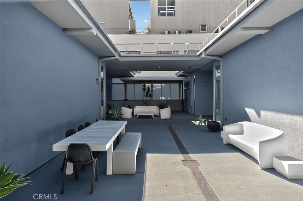 433 Pine Avenue, Unit 102 Long Beach, CA 90802 - Photo 34 of 60 a living room with furniture and a chandelier