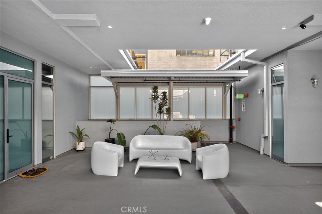 433 Pine Avenue, Unit 102 Long Beach, CA 90802 - Photo 36 of 60 a living room with furniture and a large window