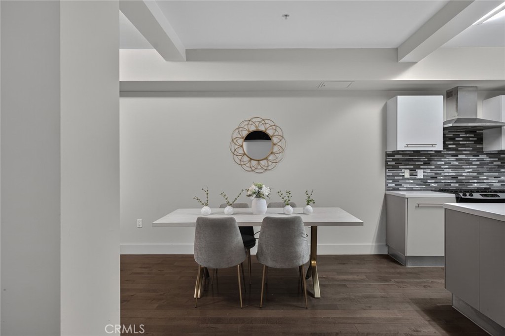 433 Pine Avenue, Unit 102 Long Beach, CA 90802 - Photo 8 of 60 a view of a dining room with furniture and wooden floor