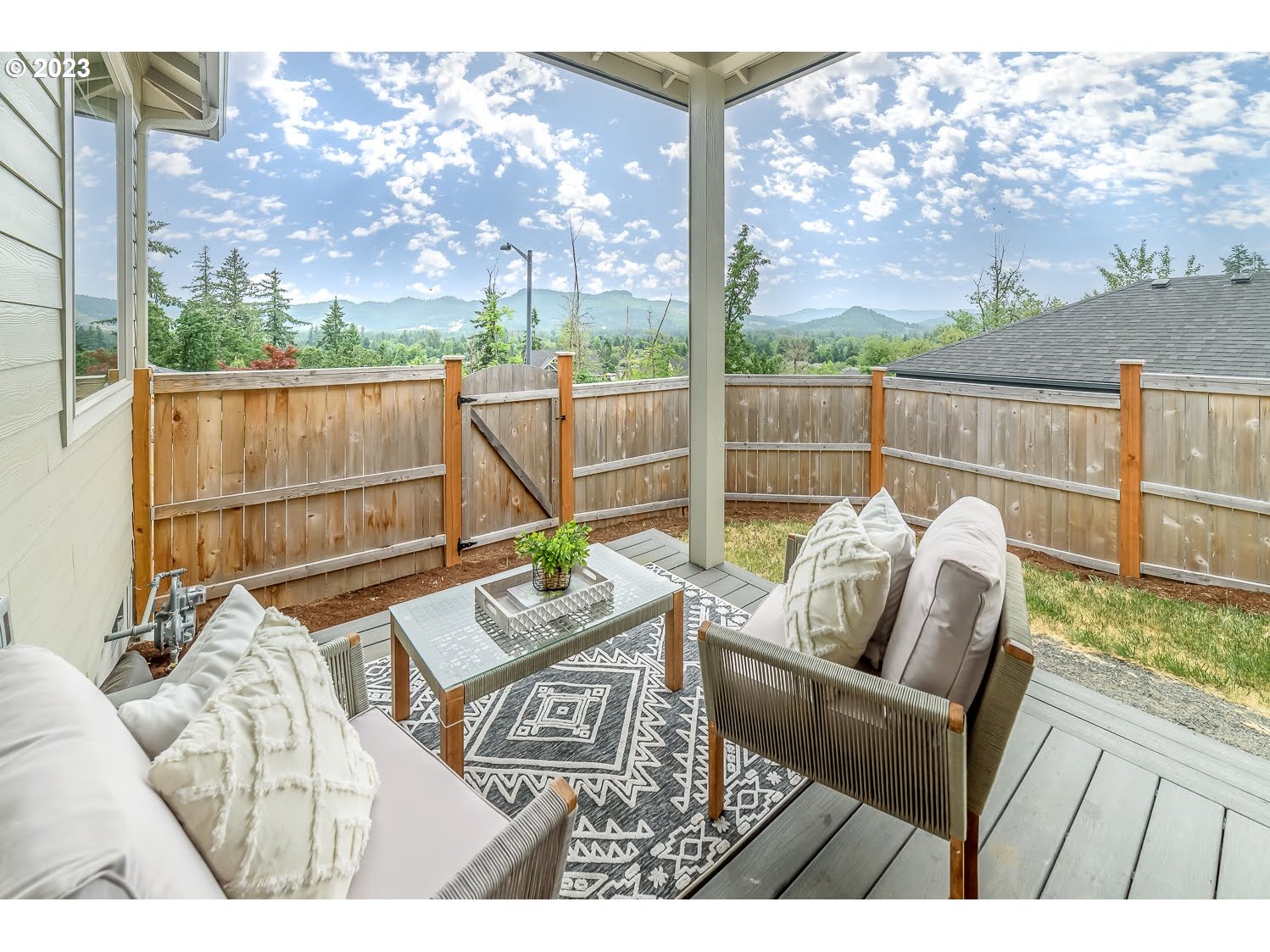 361 Mountaingate Drive Springfield, OR 97478 - Photo 32 of 35 a view of a patio with couches chairs and wooden floor