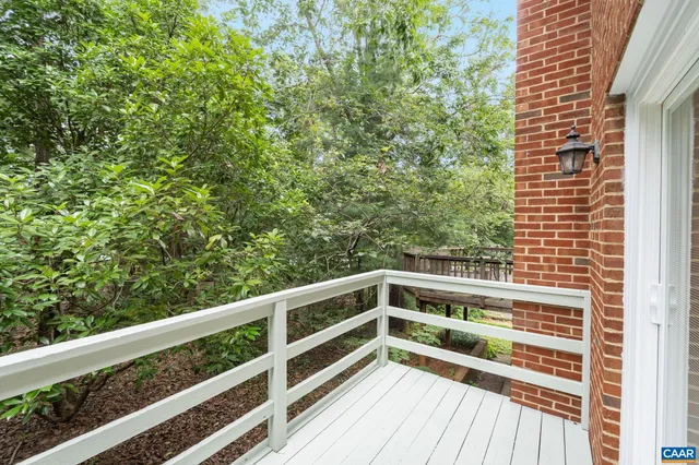 a view of balcony with wooden floor