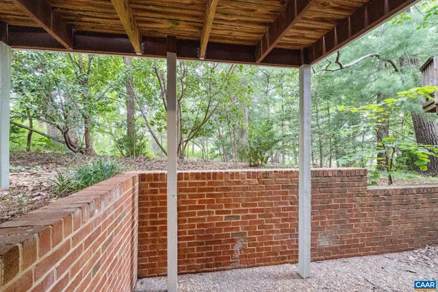 a view of balcony with green space