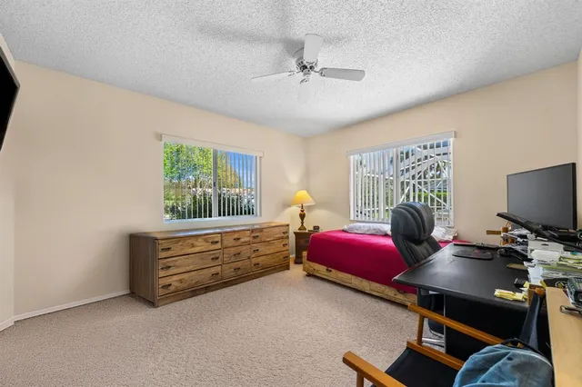 a bedroom with bed and a window