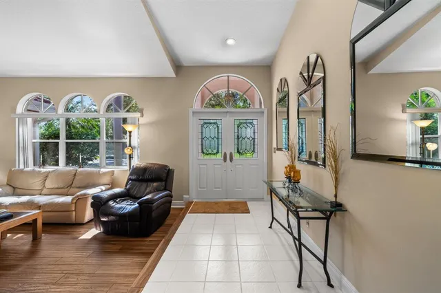 a living room with furniture and a large window