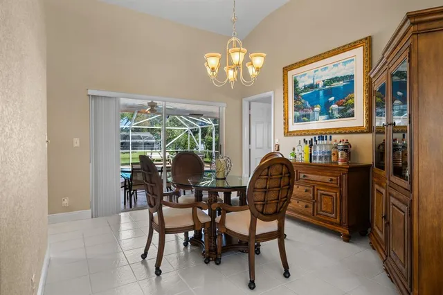 a dining room with furniture a livingroom and chandelier